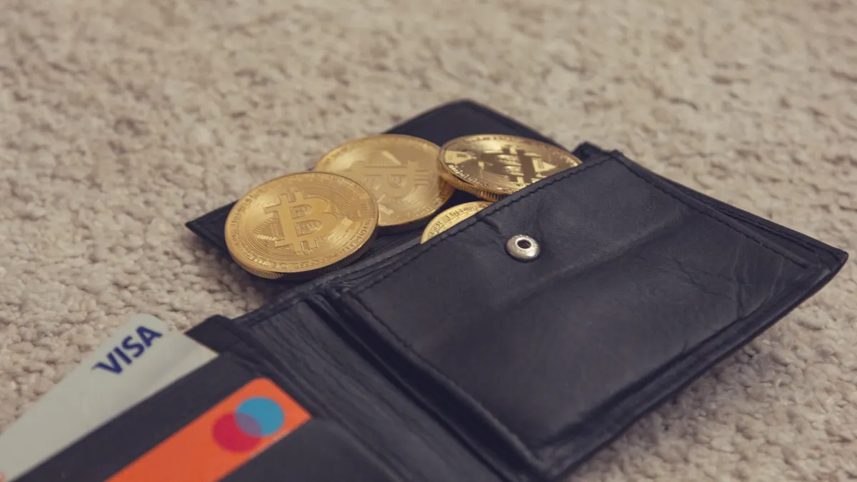 Open wallet with coins and cards
