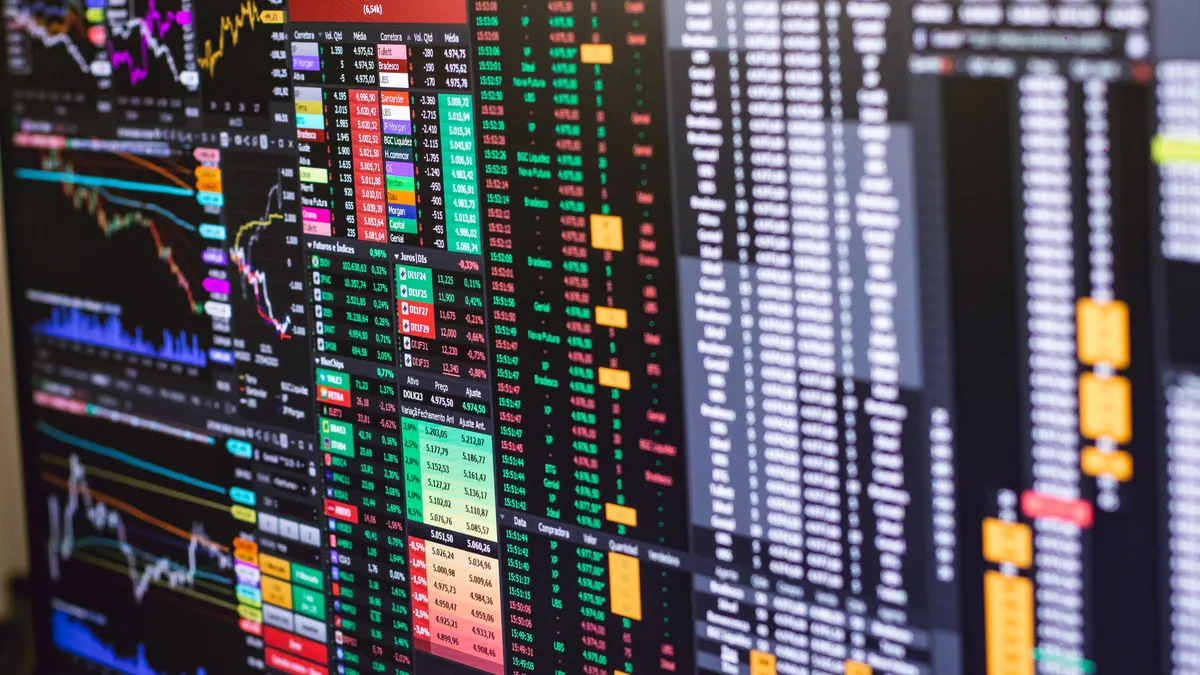 multi-screen trading terminal with charts and order book tables